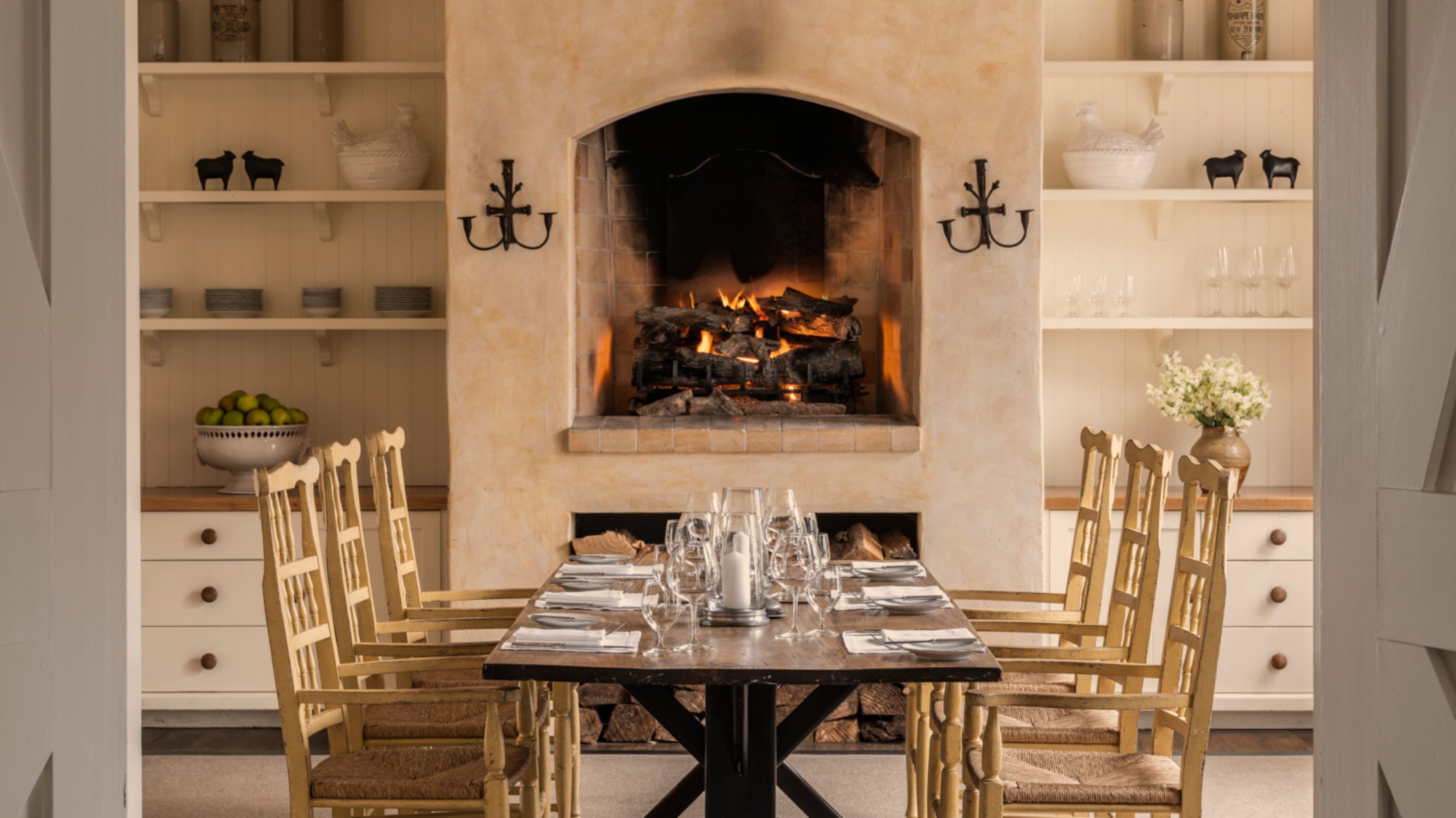 Interior view of small country style dining room with hearth